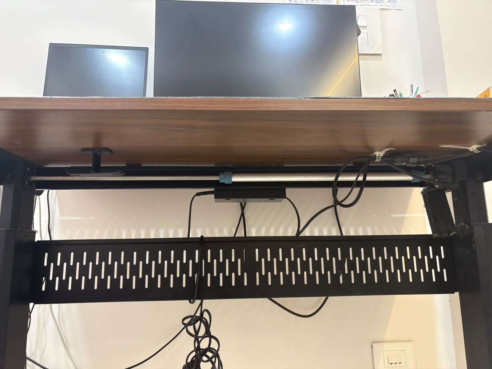 Height-adjustable desk — cable tray