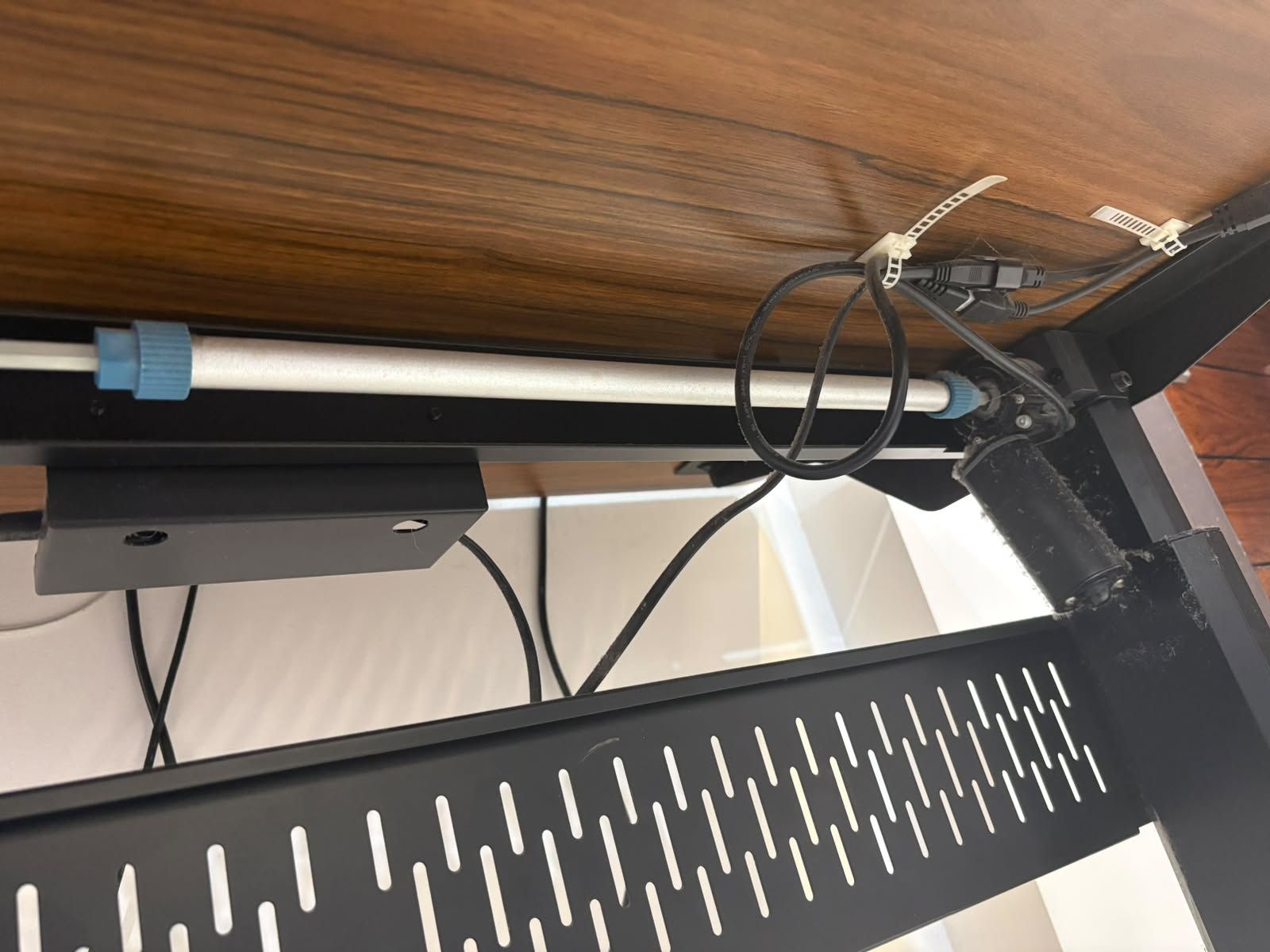 Height-adjustable desk — cable tray